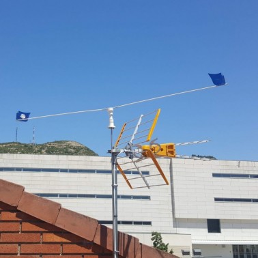 Installation of the Scarecrow for Antenna on the Roof of a House